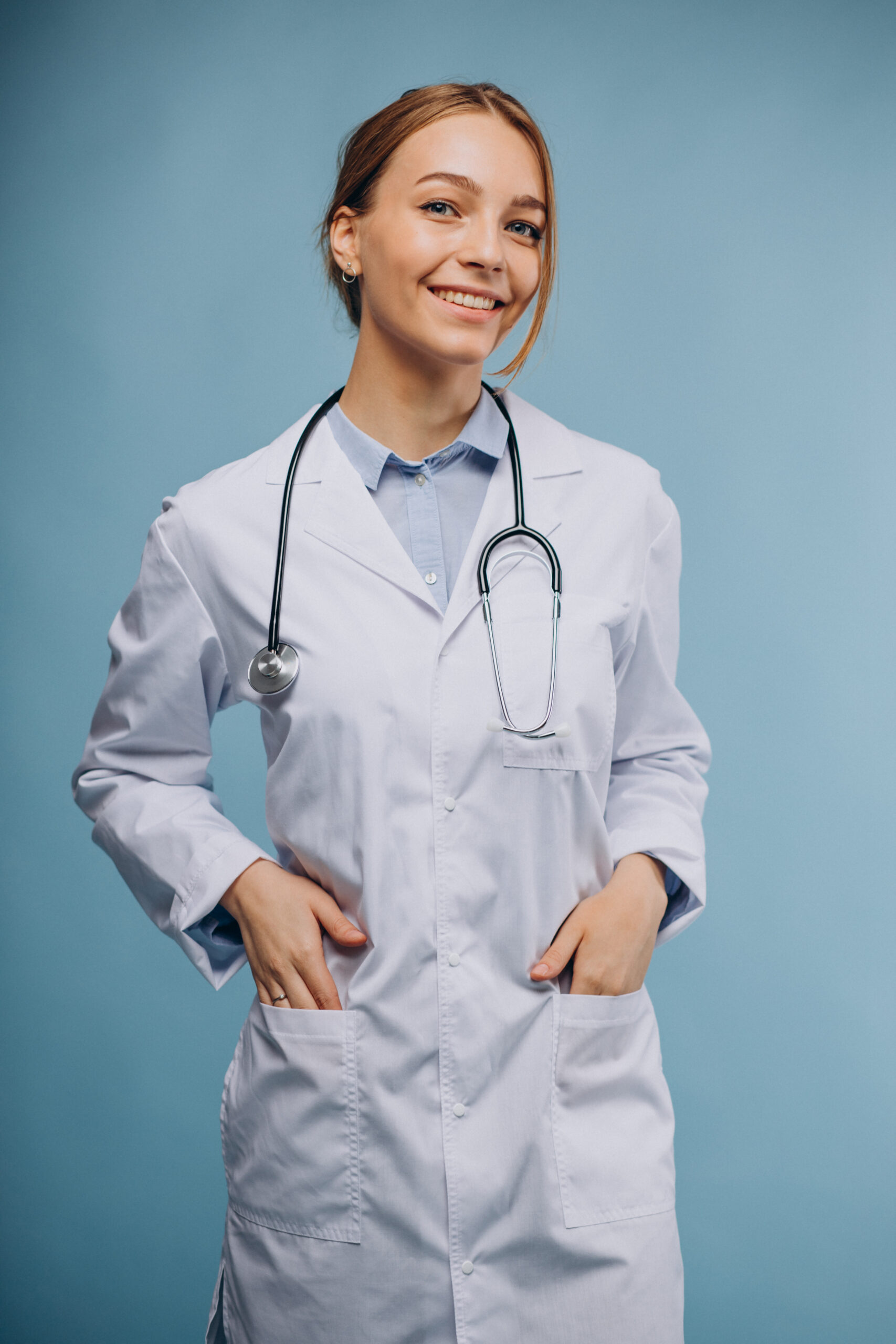 Woman doctor wearing lab robe with stethoscope isolated